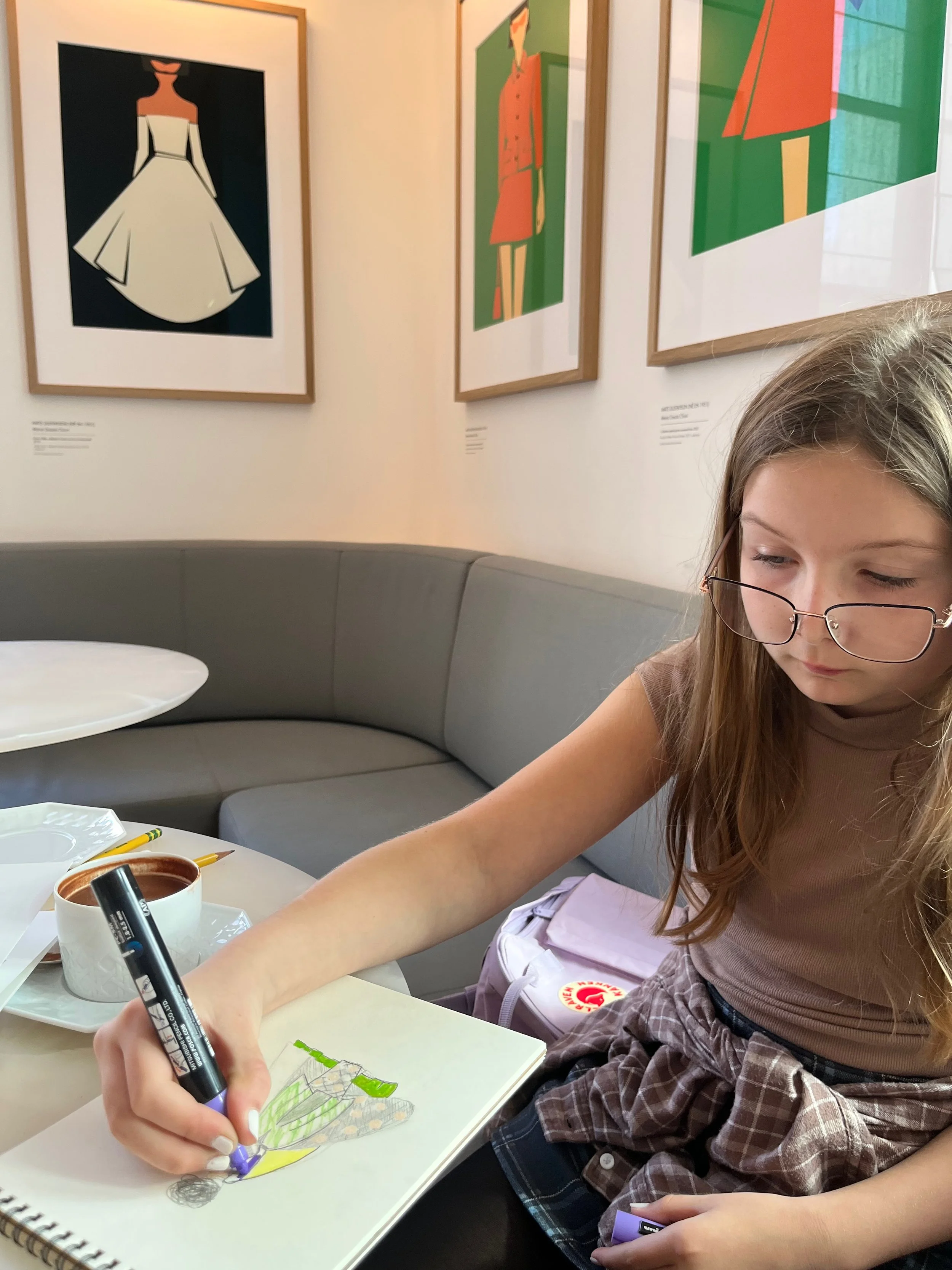 Emerson drawing in a museum gallery
